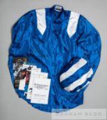 The colours of the late Hamdan Al Maktoum worn by Paul Hanagan when riding Taghrooda to victory in