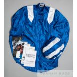 The colours of the late Hamdan Al Maktoum worn by Paul Hanagan when riding Taghrooda to victory in