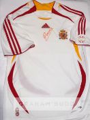 Andres Iniesta signed Spain replica jersey, signed in red marker pen, with COA incorporating photo