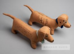 Two soft toy dachshunds signed by the Oxford and Cambridge Universities rowing crews commemorating