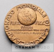 A rare FIFA 1934 World Cup official participation medal awarded to Dr Mario Tortarolo, obverse