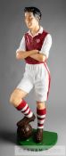 A composite Arsenal footballer shop display figure wearing the red and white strip with the late