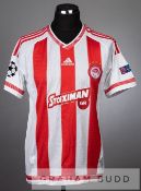 Praxitelis Vouros red and white stripped Olympiakos no.29 jersey v Arsenal in the UEFA Champions