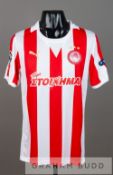 Ljubomir Fejsa red and white striped Olympiakos no.8 jersey v Arsenal in the UEFA Champions League