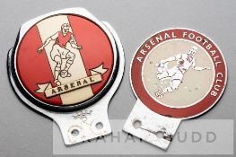 Two Arsenal FC red and white car grille badges, circa 1960s, the first featuring a footballer with