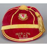 Red Wales U-23 International cap awarded in 1975-76, the red velvet with gilt tassel and braiding,