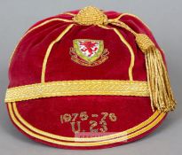 Red Wales U-23 International cap awarded in 1975-76, the red velvet with gilt tassel and braiding,
