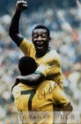 Pele signed colour photographic print celebrating in the Brazil jersey with fist in the air,
