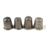 Four Victorian and Edwardian silver thimbles