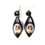 Pair of ebony miniature portrait earrings.
