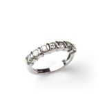 Platinum diamond half eternity ring.