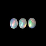 Three loose oval cut opals weighing a total of 2.70 ct.