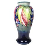 A William Moorcroft Leaf and Berry pattern vase.