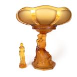 A Walter & Sohne Art Deco amber glass tazza and figurine