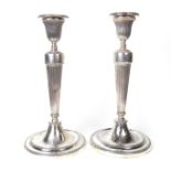 A George III pair of early Sheffield solid silver candlesticks, 18th century