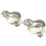 A pair of unusual Victorian hatching chick pepperettes