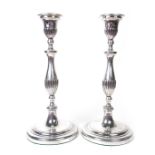 A pair of George III pair of silver candlesticks, late 18th century
