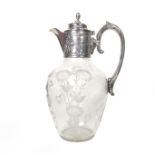 An Art Nouveau silver and glass claret jug