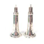 A rare Victorian novelty pair of silver lighthouse pepper casters