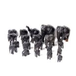 A large collection of carved ebony elephants