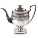 A large George III silver teapot, early 18th century