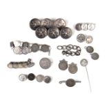 Collection of coin set items along with six livery buttons.