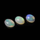 Three loose oval cut opals.