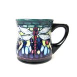 A modern Moorcroft Favrile pattern drinking mug, dated 2001