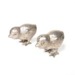 An Edwardian pair of silver chick pepperettes