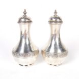 A pair of Victorian silver casters