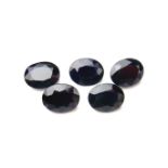 Five loose oval cut sapphires.