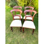 A group of four Victorian mahogany campaign chairs, mid 19th century