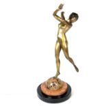 An Art Deco brass nude figure of a dancing female