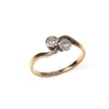 9 ct yellow gold and platinum two stone diamond crossover ring.