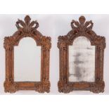 Coppia di specchiere in legno intagliato a volute fogliacee, Francia - XIX secolo.