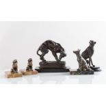 Lotto composto da cinque sculture raffiguranti “Cani” di diverse fogge e materiali, XX secolo.