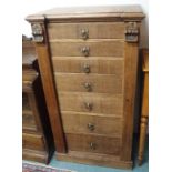 An oak Wellington chest with seven graduating drawers with brass handles, 108cm high x 60cm wide x