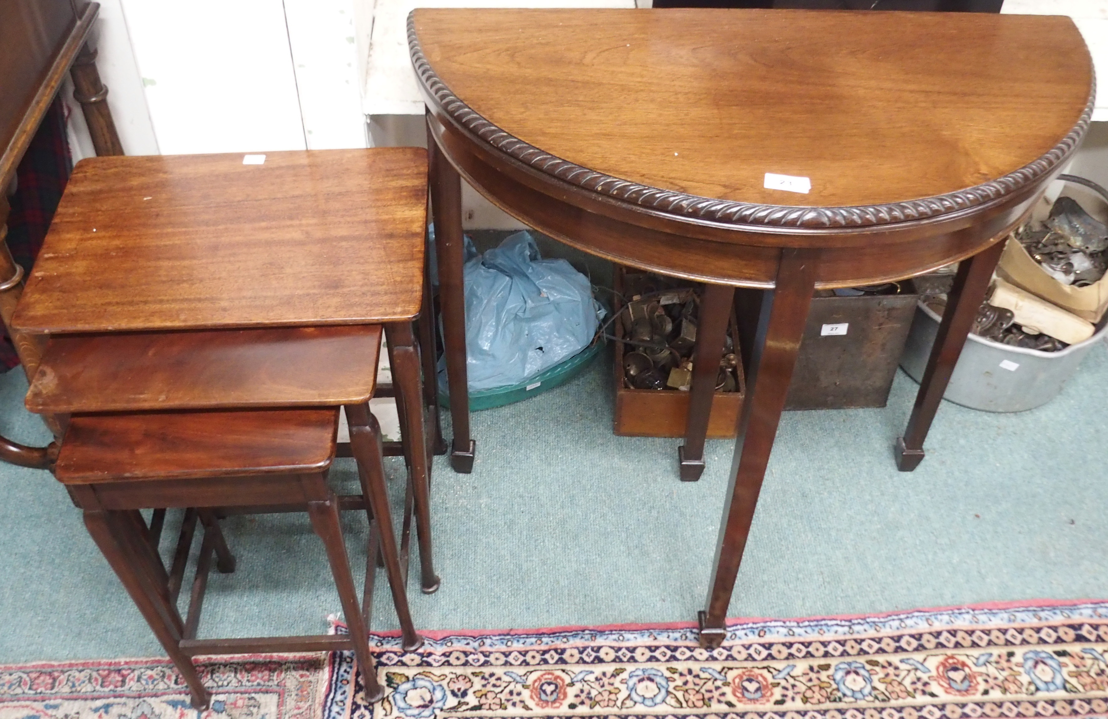 A mahogany nest of tables and a small demi-lune fold over card table (2) Condition Report: