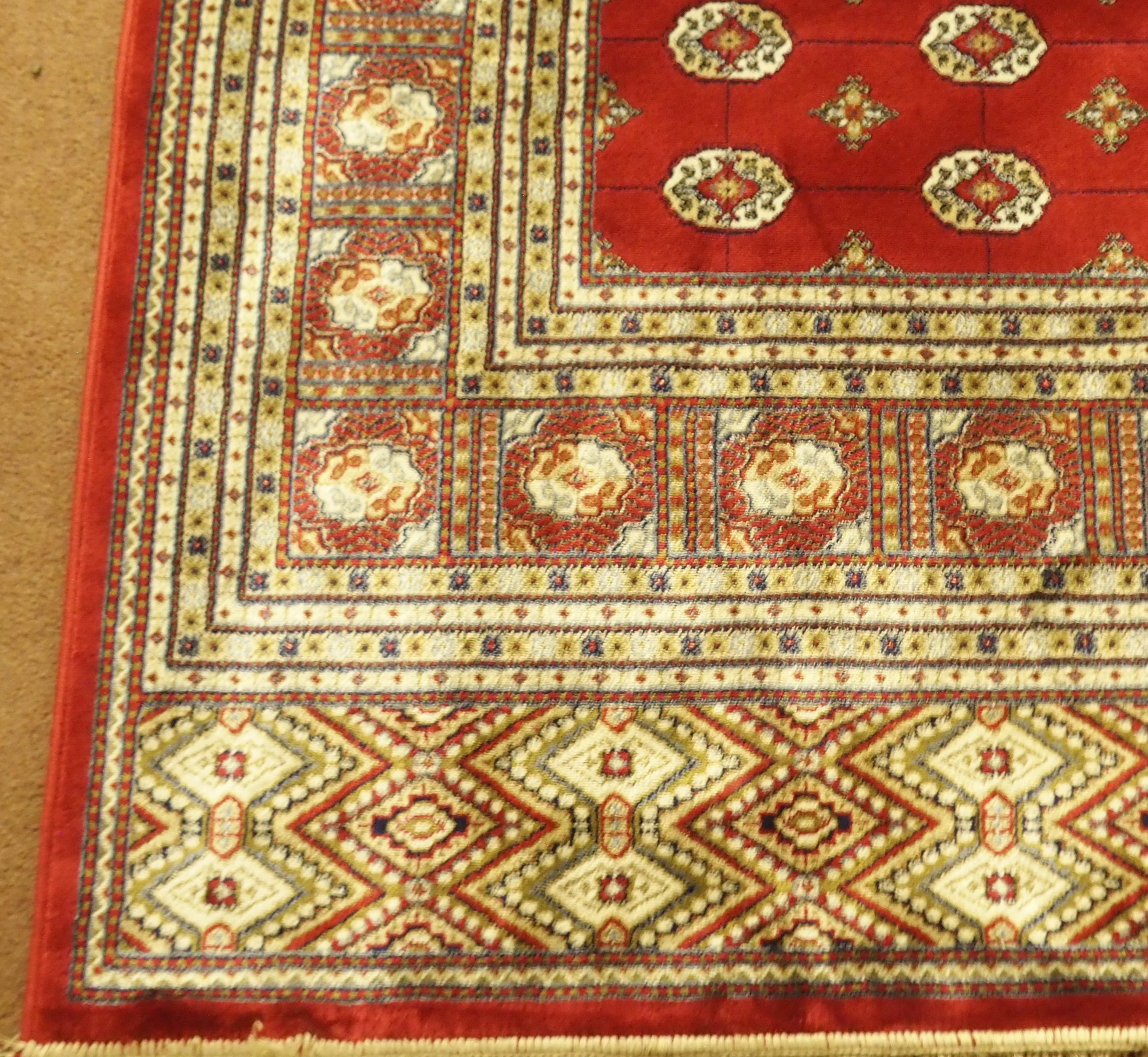 A Kashmir rug with a red ground Bokhara design, 300cm x 197cm Condition Report: Available upon - Image 3 of 3