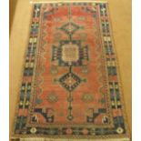 A red ground Eastern rug with geometric design, 230cm x 128cm Condition Report: Available upon