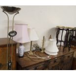 An Oriental brass topped table (def), three brass table lamps, floor lamp and a ceramic table