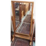 A large oak cheval mirror with barley twist supports, 162cm high x 84cm wide x 54cm deep Condition