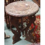 A carved hardwood oriental occasional table, 60cm high x 46cm diameter Condition Report: Available