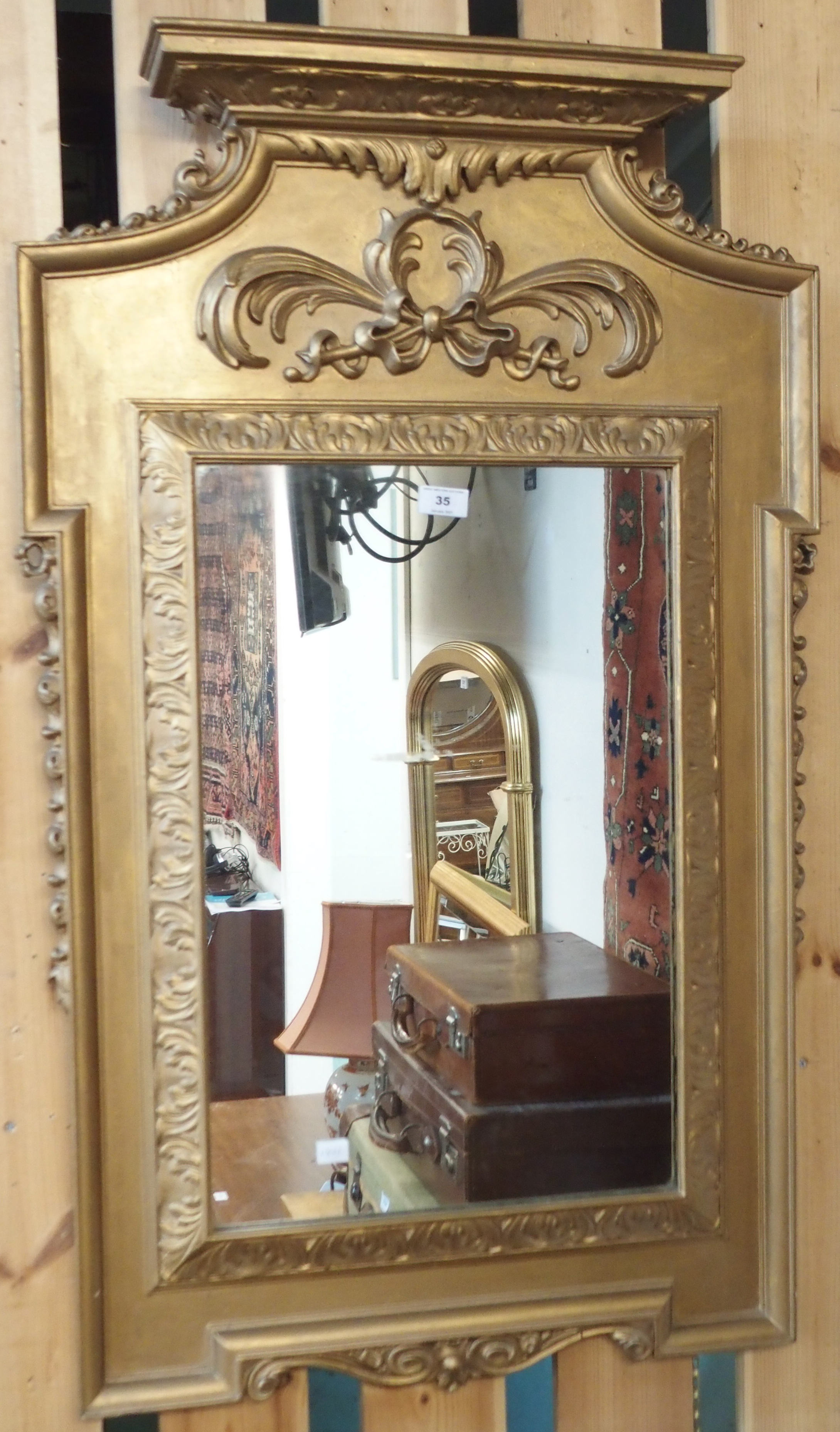 A gilt framed pier mirror, 105cm high x 65cm wide Condition Report: Available upon request