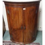 A Georgian mahogany bow front hanging corner cabinet, 105cm high x 75cm wide Condition Report: