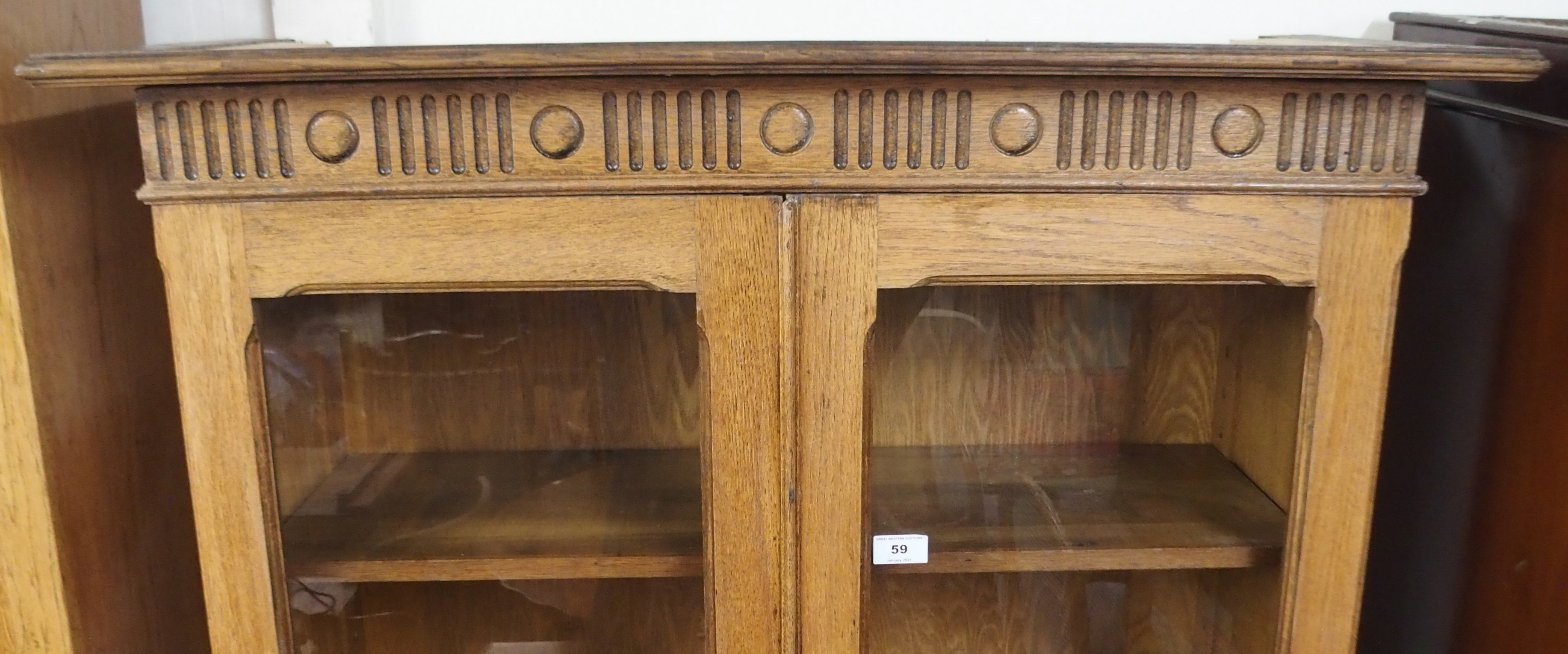 An oak bookcase with two glazed doors over doors with central inlay, 191cm high x 95cm wide x 34cm - Image 2 of 3