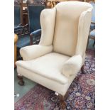 A wingback chair with ball and claw feet Condition Report: Available upon request