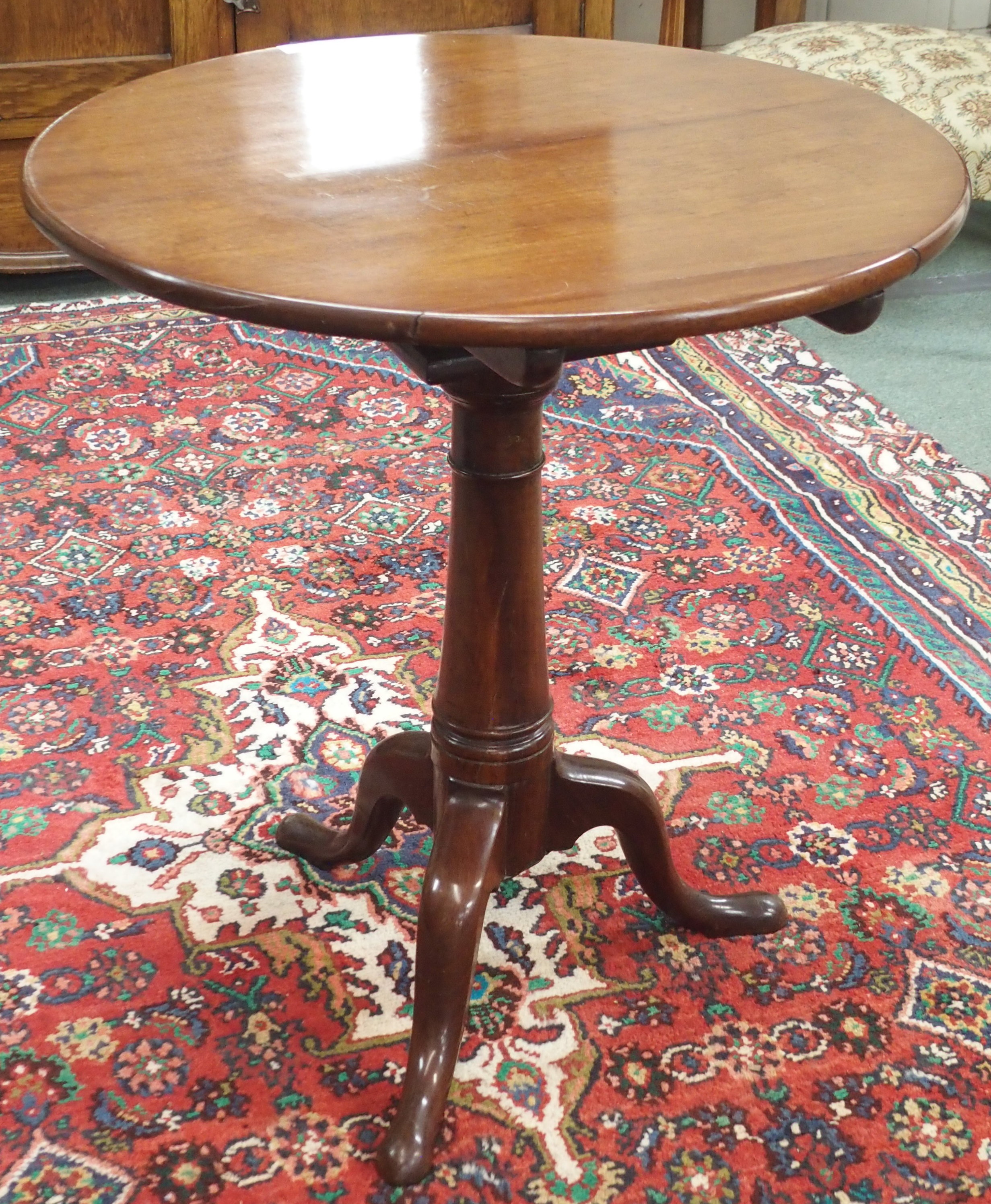 A mahogany circular tilt top occasional table on tripod base, 69cm high x 63cm diameter Condition