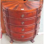 A dwarf mahogany demi-lune chest with twelve drawers, 76cm high x 68cm wide x 33cm deep Condition