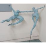 A large green patinated resin figure of two naked figures dancing, monogrammed, and numbered II/